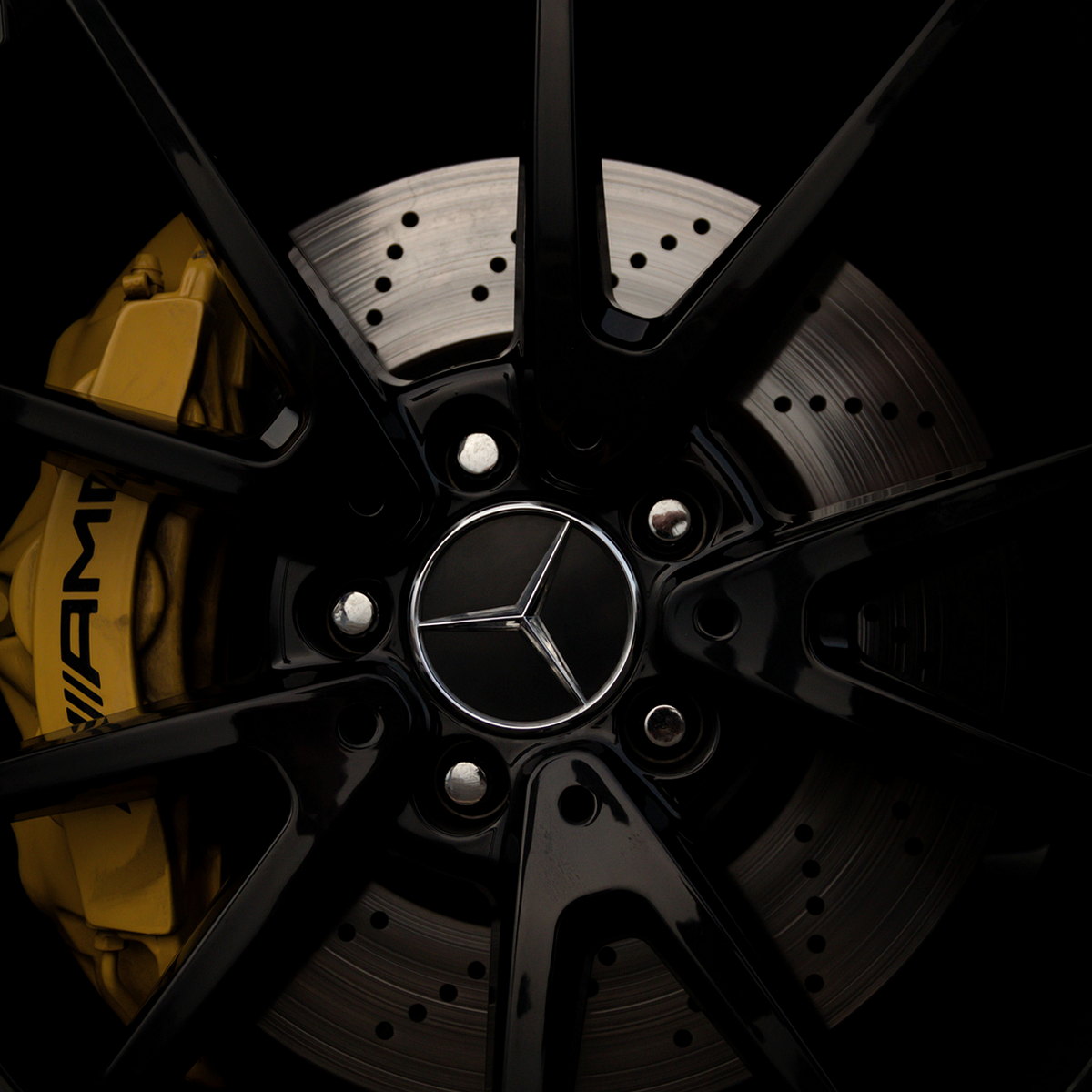 Gloss black painted alloy with a yellow brake caliper